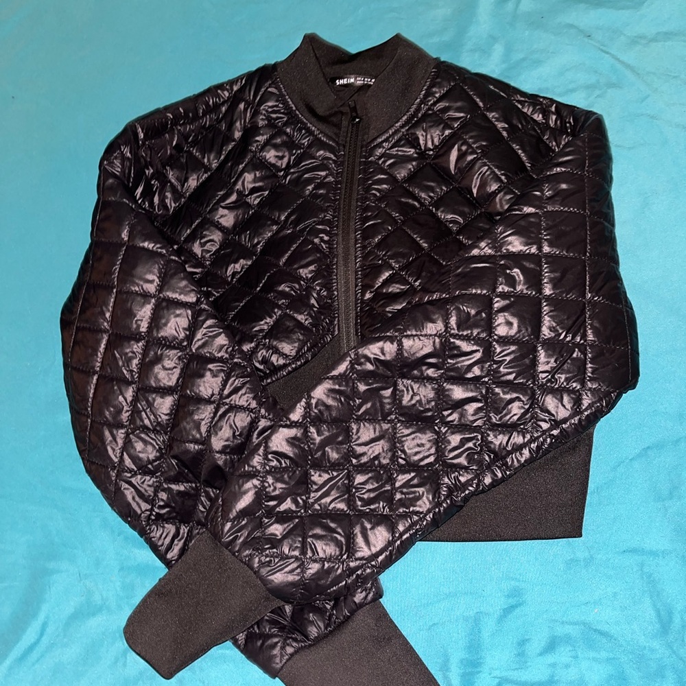 Black jacket never worn before.